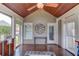 Relaxing screened porch featuring wood floors, ceiling fan, and ample natural light at 1608 Mulberry Lake Dr, Dacula, GA 30019