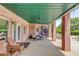 Covered patio with comfortable seating, ceiling fan, and access to a pool area at 1608 Mulberry Lake Dr, Dacula, GA 30019