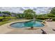 Beautiful in-ground pool, putting green, and lush landscaping overlooking a tranquil lake at 1608 Mulberry Lake Dr, Dacula, GA 30019