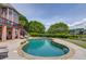 Backyard pool and patio with beautiful landscaping, golf putting green, and lake view at 1608 Mulberry Lake Dr, Dacula, GA 30019