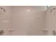 This minimalist all-white tiled shower with dual shower heads offers a clean and modern bathing experience at 1608 Mulberry Lake Dr, Dacula, GA 30019