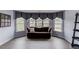 Cozy sitting area with windows, a couch and decorative shelving at 1608 Mulberry Lake Dr, Dacula, GA 30019