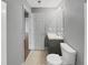 Modern bathroom with gray walls, vanity, toilet, and a doorway leading out of the room at 3146 Leyland Ct, Decatur, GA 30034