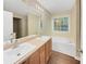 Bright bathroom with double vanity, bathtub, and large mirror and natural lighting at 3146 Leyland Ct, Decatur, GA 30034