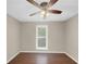 Neutral bedroom featuring laminate floors, a large window and plenty of natural light at 3146 Leyland Ct, Decatur, GA 30034
