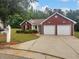 Beautiful home with a two-car garage, landscaped front yard and visible address at 3146 Leyland Ct, Decatur, GA 30034