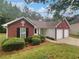 Attractive home featuring a manicured lawn and an attached two-car garage at 3146 Leyland Ct, Decatur, GA 30034