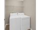 Functional laundry room with a modern washer and dryer set, and shelf at 3146 Leyland Ct, Decatur, GA 30034
