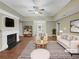 Staged living room featuring a fireplace, modern furniture, and plenty of natural light at 3146 Leyland Ct, Decatur, GA 30034