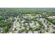 Aerial view of a community with tree-lined streets and well-manicured lawns at 315 Hembree Grove Trce, Roswell, GA 30076