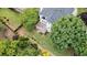 Aerial view of home with multi-level deck overlooking a beautifully landscaped backyard at 315 Hembree Grove Trce, Roswell, GA 30076