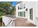 The back of the home features a wooden deck with white railings at 315 Hembree Grove Trce, Roswell, GA 30076