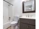 Compact bathroom with a shower-tub, patterned floors and vanity at 315 Hembree Grove Trce, Roswell, GA 30076