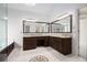 Spacious bathroom boasts dual sinks, dark cabinetry, and granite countertops at 315 Hembree Grove Trce, Roswell, GA 30076
