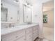 Bright bathroom with double sinks, vanity and bright lighting at 315 Hembree Grove Trce, Roswell, GA 30076