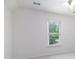 Bedroom showcasing a bright window and neutral carpeting at 315 Hembree Grove Trce, Roswell, GA 30076