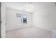 Bright bedroom featuring neutral carpet, ceiling fan and a window at 315 Hembree Grove Trce, Roswell, GA 30076