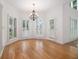 Bright breakfast nook with hardwood floors, chandelier, and large windows with plantation shutters at 315 Hembree Grove Trce, Roswell, GA 30076