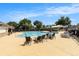 Large community pool with lounge chairs and tables, perfect for relaxing and entertaining at 315 Hembree Grove Trce, Roswell, GA 30076