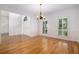 Dining room with hardwood floors, white wainscoting, and plenty of natural light at 315 Hembree Grove Trce, Roswell, GA 30076