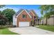 Elegant brick home with a two-car garage, manicured lawn, and inviting front entrance at 315 Hembree Grove Trce, Roswell, GA 30076
