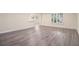 Bright living room with sleek gray wood-look flooring and lots of natural light at 315 Hembree Grove Trce, Roswell, GA 30076