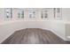 Cozy living room features chair rail, white trim, and wood-look flooring at 315 Hembree Grove Trce, Roswell, GA 30076