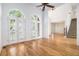 Bright living room featuring hardwood floors, tall ceilings, large windows and stair case view at 315 Hembree Grove Trce, Roswell, GA 30076