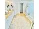 Spacious bathroom with granite countertops, a soaking tub, and ceramic tile flooring at 6725 Grove Meadows Ln, Cumming, GA 30028