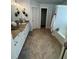 Spacious bathroom featuring double vanity with granite countertops, neutral tile floors, and bathtub with a shower at 6725 Grove Meadows Ln, Cumming, GA 30028
