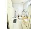 Bathroom with tiled floors, modern vanity, and ample storage at 6725 Grove Meadows Ln, Cumming, GA 30028