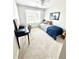 Bright bedroom with a ceiling fan, plush carpet, and a large window overlooking the landscaped exterior at 6725 Grove Meadows Ln, Cumming, GA 30028