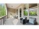 Inviting outdoor balcony with black wicker chairs and views of the surrounding greenery at 1914 Forte Ln, Alpharetta, GA 30009