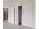 Bedroom closet showcasing white doors and shelving, providing storage solutions at 1914 Forte Ln, Alpharetta, GA 30009