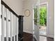 Bright entryway featuring a staircase and a glimpse of the outdoors through the front door at 1914 Forte Ln, Alpharetta, GA 30009