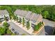 Beautiful townhome with manicured landscaping, charming curb appeal, and mature trees at 1914 Forte Ln, Alpharetta, GA 30009