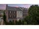 Beautifully maintained townhome with classic architectural details and mature trees at 1914 Forte Ln, Alpharetta, GA 30009