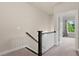 Upstairs hallway with modern railings leads to bedrooms at 1914 Forte Ln, Alpharetta, GA 30009