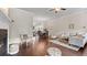 Open-concept living area flows into the dining and kitchen spaces, showcasing dark hardwood floors at 1914 Forte Ln, Alpharetta, GA 30009