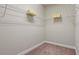 Walk-in closet with wire shelving and neutral carpeting, providing ample storage space at 1914 Forte Ln, Alpharetta, GA 30009