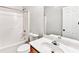 Bathroom with shower-tub combo, white toilet, and vanity with a clear faucet at 2173 Pebble Beach Dr, Lawrenceville, GA 30043
