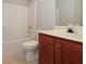 Bathroom featuring a standard white toilet, vanity, and shower/tub at 2173 Pebble Beach Dr, Lawrenceville, GA 30043
