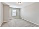 Bedroom with carpeted floor, a window that lets in natural light, and neutral walls at 2173 Pebble Beach Dr, Lawrenceville, GA 30043