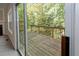 A view through the sliding glass door on to the wooden deck at 2173 Pebble Beach Dr, Lawrenceville, GA 30043