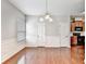 Bright dining area with hardwood floors and a stylish chandelier at 2173 Pebble Beach Dr, Lawrenceville, GA 30043