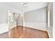 Dining room featuring beautiful hardwood floors, classic wainscoting, and ample natural light at 2173 Pebble Beach Dr, Lawrenceville, GA 30043