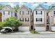 Charming townhome featuring a brick facade, attached garage, and neatly landscaped front yard at 2173 Pebble Beach Dr, Lawrenceville, GA 30043