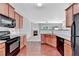 Charming kitchen with wood cabinets, modern appliances, and hardwood floors at 2173 Pebble Beach Dr, Lawrenceville, GA 30043