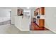 Open-concept living room with breakfast bar and sleek hardwood floors at 2173 Pebble Beach Dr, Lawrenceville, GA 30043