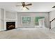 Living room with fireplace, neutral carpet, large window, and patio access at 2173 Pebble Beach Dr, Lawrenceville, GA 30043